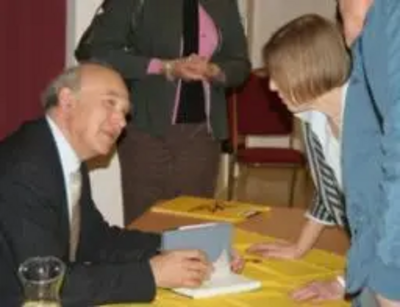 Vince Cable signing his book - The Storm