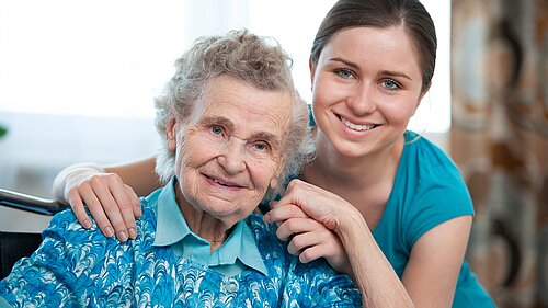 An elderly and her grandaughter.