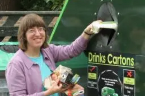 Cllr Caroline Nichols recycling her cartons at the Avenue car park in Sunbury